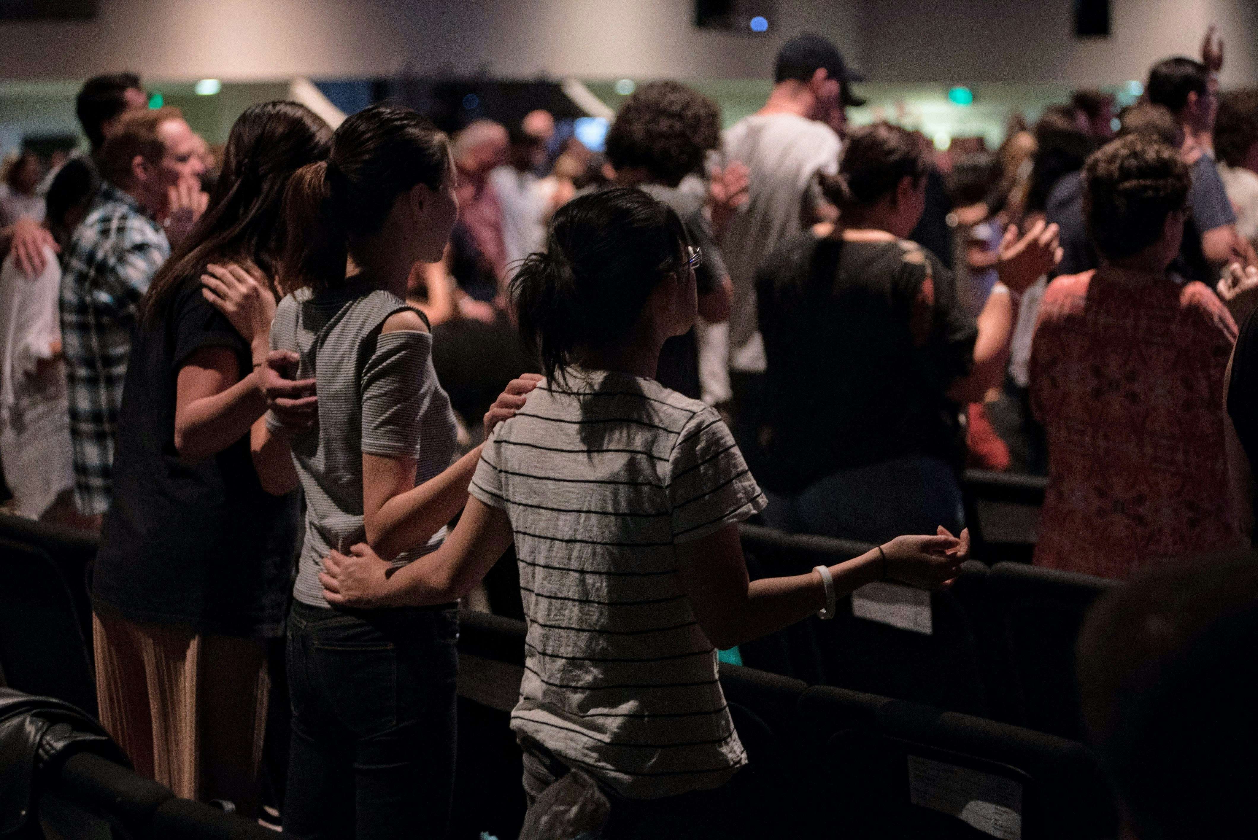 Young people in communal prayer.