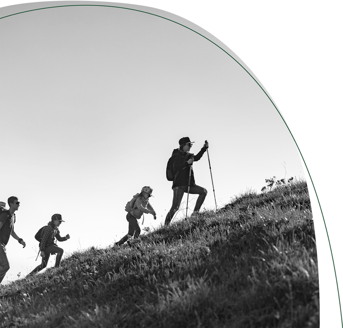 Four hikers climbing a steep mountain.